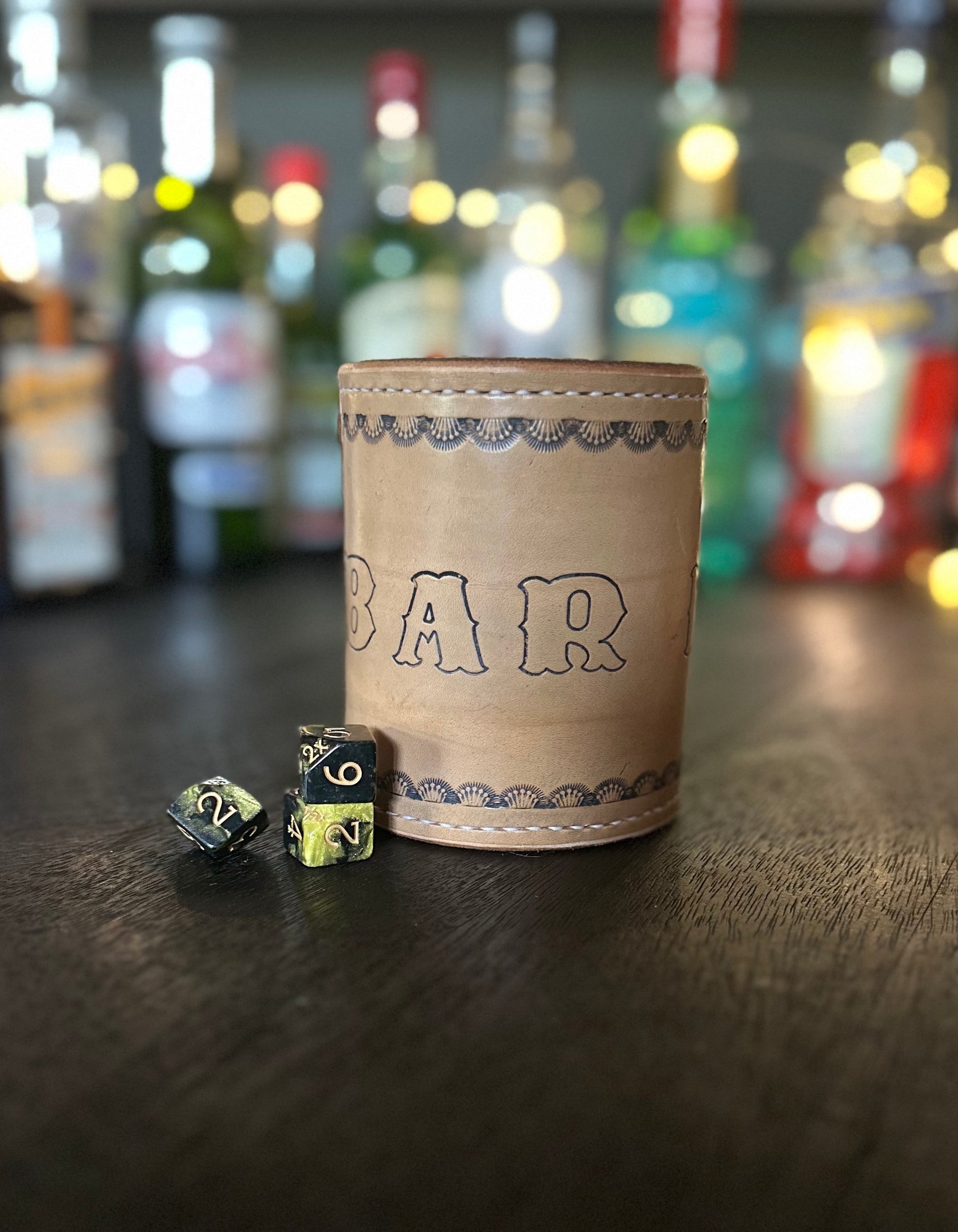 handmade leather dice cup "bar dice" in front of rare chance dice