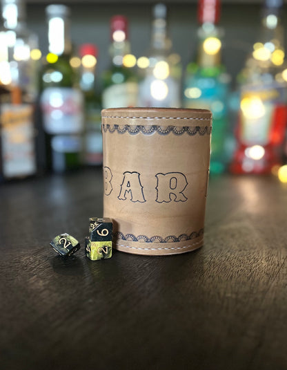 handmade leather dice cup "bar dice" in front of rare chance dice